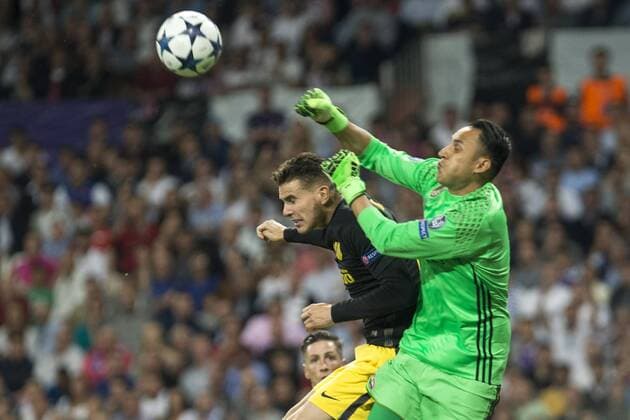 Lucas Hernandez of Atletico de Madrid competes for the ball with Keylor Navas of Real Madrid during the match of Champions League between Real Madrid and Atletico de Madrid at Santiago Bernabeu Stadium in Madrid, Spain. May 02, 2017.  (20170502088)