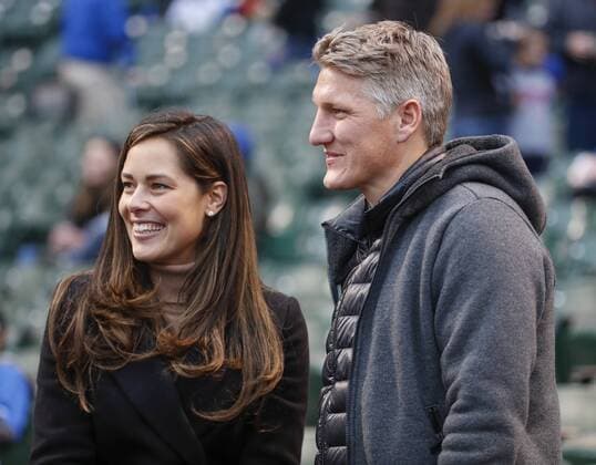 Chicago Fire soccer player Bastian Schweinsteiger (R) and his wife Ana Ivanovic attend the Chicago Cubs game against the Philadelphia Phillies at Wrigley Field on May 2, 2017 in Chicago.  CHI2017050217 KAMILxKRZACZYNSKI