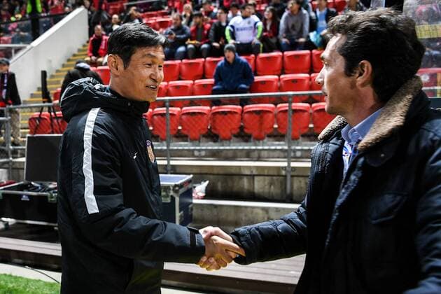 Head coach Choi Yong-soo of China s Jiangsu Suning FC, left, shakes hands with head coach Guillermo Amor of Australia s Adelaide United FC in their Group H match during the 2017 AFC Champions League in Adelaide, Australia, 9 May 2017. Adelaide United FC competes against Jiangsu Suning at 2017 AFC Champions League  20170509_61898