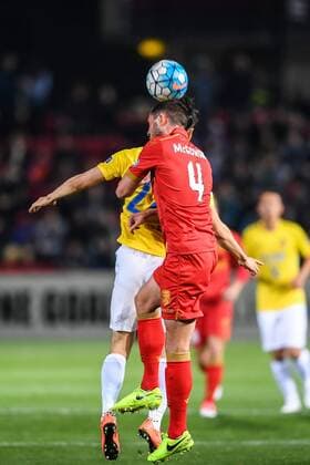 Dylan McGowan of Australia s Adelaide United FC, right, heads the ball against a player of China s Jiangsu Suning FC in their Group H match during the 2017 AFC Champions League in Adelaide, Australia, 9 May 2017. Local Caption Adelaide United FC competes against Jiangsu Suning at 2017 AFC Champions League  20170509_62012