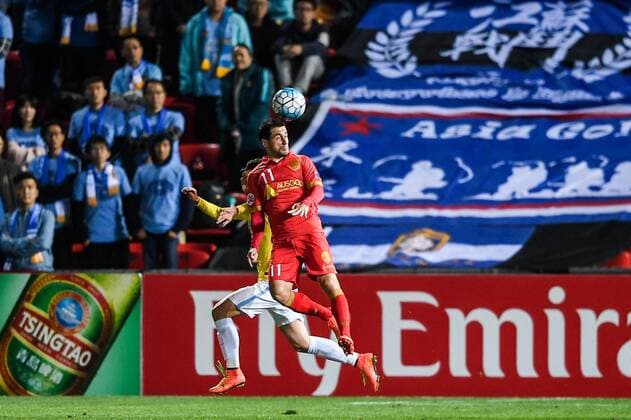 Sergio Cirio of Australia s Adelaide United FC, front, heads the ball against a player of China s Jiangsu Suning FC in their Group H match during the 2017 AFC Champions League in Adelaide, Australia, 9 May 2017. Local Caption Adelaide United FC competes against Jiangsu Suning at 2017 AFC Champions League  20170509_62076
