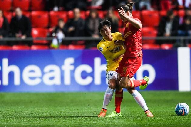 Chen Ji of China s Jiangsu Suning FC, left, challenges a player of Australia s Adelaide United FC in their Group H match during the 2017 AFC Champions League in Adelaide, Australia, 9 May 2017. Local Caption Adelaide United FC competes against Jiangsu Suning at 2017 AFC Champions League  20170509_62093