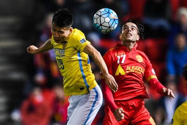 Nikola Mileusnic of Australia s Adelaide United FC, right, challenges Yang Xiaotian of China s Jiangsu Suning FC in their Group H match during the 2017 AFC Champions League in Adelaide, Australia, 9 May 2017. Local Caption Adelaide United FC competes against Jiangsu Suning at 2017 AFC Champions League  20170509_82610