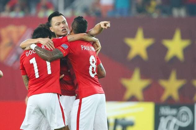 Brazilian football players Ricardo Goulart, Paulinho and Chinese player Gao Lin of China s Guangzhou Evergrande F.C. celebrate after scoring a goal against South Korea s Suwon Samsung Bluewings in a Group G during the 2017 AFC Champions League in Guangzhou city, south China s Guangdong province, 9 May 2017. Local Caption Guangzhou Evergrande competes against Suwon Samsung Bluewings at 2017 AFC Champions League  20170509_31183