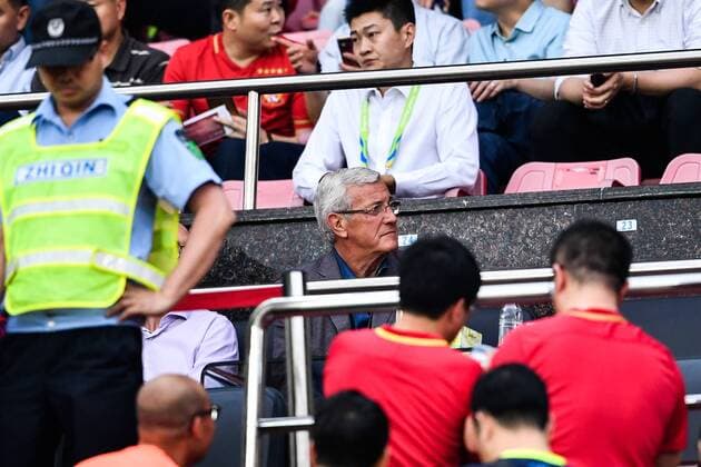 Head coach of Chinese national men s football team Marcello Lippi watches a Group G match between China s Guangzhou Evergrande F.C. and South Korea s Suwon Samsung Bluewings during the 2017 AFC Champions League in Guangzhou city, south China s Guangdong province, 9 May 2017. Local Caption Guangzhou Evergrande competes against Suwon Samsung Bluewings at 2017 AFC Champions League  20170509_62085