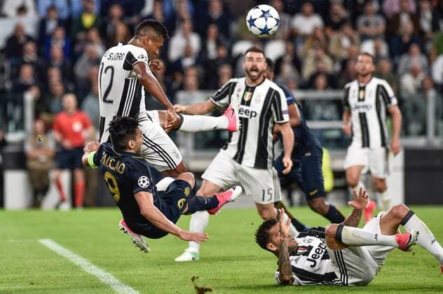 Alex Sandro of Juventus challenges Radamel Falcao Garc’a of Monaco during the UEFA Champions League Semi-Final game 2 match between Juventus and Monaco at the Juventus Stadium, Turin, Italy on 9 May 2017. Copyright: xGiuseppexMaffiax 15320073