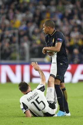 FuÃŸball, CL, Juventus Turin - AS Monaco May 9th 2017, Juventus Stadium, Turin, Italy; UEFA Champions League semi-final, Juventus versus AS Monaco 2nd leg; Kylian Mbappe helps Andrea Barzagli who is suffering for cramps xPierpaoloxPiciuccox  ActionPlus11877646
