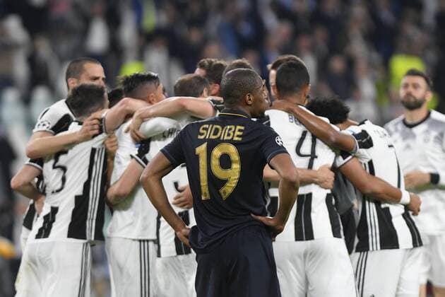 FuÃŸball, CL, Juventus Turin - AS Monaco May 9th 2017, Juventus Stadium, Turin, Italy; UEFA Champions League semi-final, Juventus versus AS Monaco 2nd leg; Djibril Sidibe watches dejected as Juventus players celebrate together xPierpaoloxPiciuccox  ActionPlus11877653