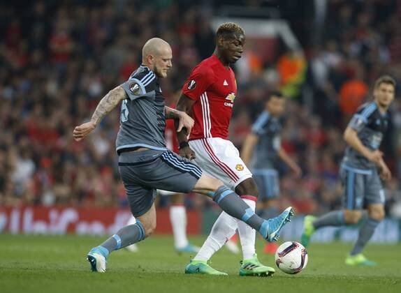 Paul Pogba of Manchester United ManU in action with John Guidetti of Celta Vigo during the Europa League Semi Final 2nd Leg match at Old Trafford Stadium, Manchester. Picture date: May 11th 2017. Pic credit should read: Simon Bellis Sportimage EDITORIAL USE ONLY. No use with unauthorised audio, video, data, fixture lists, club league logos or live services. Online in-match use limited to 120 images, no video emulation. No use in betting, games or single club league player publications.
