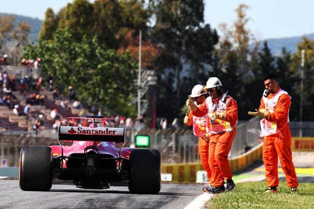 Spanish Grand Prix, Barcelona 11 - 14 May 2017 Sebastian Vettel (GER) Ferrari SF70H is pushed back to the pits by mechanics after stopping in the first practice session. 12.05.2017. 