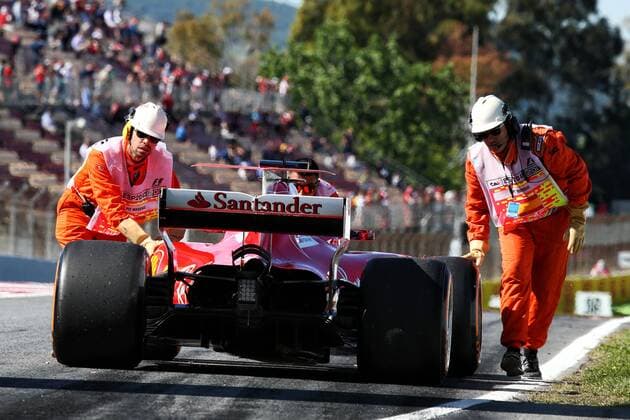 Spanish Grand Prix, Barcelona 11 - 14 May 2017 Sebastian Vettel (GER) Ferrari SF70H is pushed back to the pits by mechanics after stopping in the first practice session. 12.05.2017. 