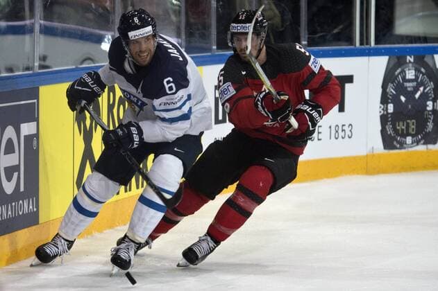 From left: Topi Jaakola of Finland and Mark Scheifele of Canada in action during the Ice hockey Eishockey World Championships group B match between Canada and Finland in Paris, France, Tuesday, May 16, 2017. (CTKxPhoto MichalxKamaryt) CTKPhotoP201705160991101  kmt 2