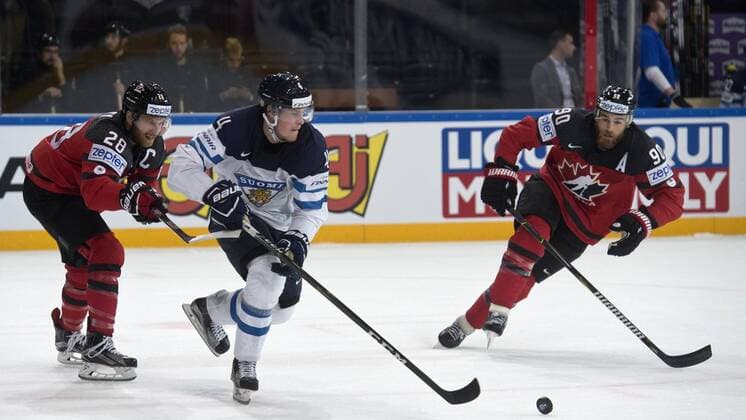 From left: Claude Giroux of Canada, Mikko Lehtonen of Finland and Ryan O Reilly of Canada in action during the Ice hockey Eishockey World Championships group B match between Canada and Finland in Paris, France, Tuesday, May 16, 2017. (CTKxPhoto MichalxKamaryt) CTKPhotoP201705160993101  kmt 3