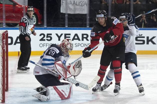 From left: goalkeeper of Finland Harri Sateri, Travis Konecny of Canada and Antti Pihlstrom of Finland in action during the Ice hockey Eishockey World Championships group B match between Canada and Finland in Paris, France, Tuesday, May 16, 2017. (CTKxPhoto MichalxKamaryt) CTKPhotoP201705161043001  kmt 7