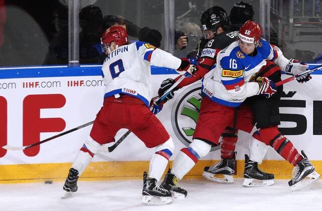 COLOGNE, GERMANY - MAY 20, 2017: Russia s Viktor Antipin, Sergei Plotnikov (L-R front), and Canada s Claude Giroux (R back) in their 2017 IIHF Ice hockey Eishockey World Championship WM Weltmeisterschaft semifinal match at Lanxess Arena. Anton Novoderezhkin TASS  TS04F6CF