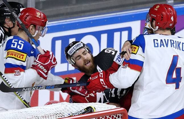 COLOGNE, GERMANY - MAY 20, 2017: Russia s Bogdan Kiselevich (L front), Vladislav Gavrikov (R) and Canada s Ryan O Reilly (C) in their 2017 IIHF Ice hockey Eishockey World Championship WM Weltmeisterschaft semifinal match at Lanxess Arena. Anton Novoderezhkin TASS  TS04F6D0