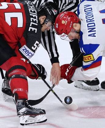 COLOGNE, GERMANY - MAY 20, 2017: Canada s Mark Scheifele (L) and Russia s Sergei Andronov (R) during a face off in their 2017 IIHF Ice hockey Eishockey World Championship WM Weltmeisterschaft semifinal match at Lanxess Arena. Anton Novoderezhkin TASS  TS04F6DE