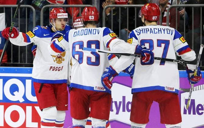 COLOGNE, GERMANY - MAY 20, 2017: Russia s Artemy Panarin, Yevgeny Dadonov, and Vadim Shipachev (L-R) celebrate a goal against Canada in their 2017 IIHF Ice hockey Eishockey World Championship WM Weltmeisterschaft semifinal match at Lanxess Arena. Anton Novoderezhkin TASS  TS04F703