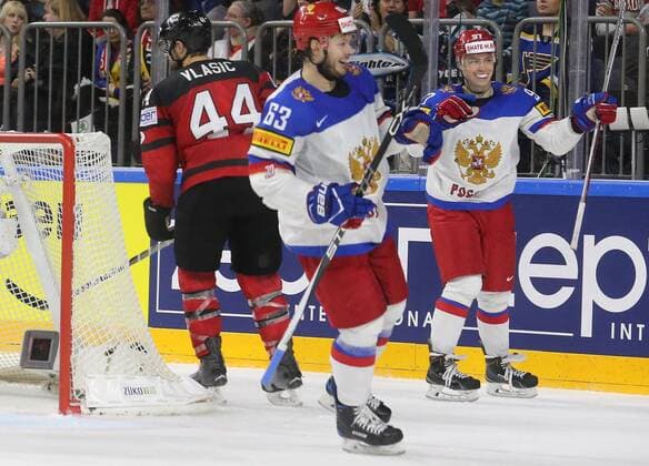 COLOGNE, GERMANY - MAY 20, 2017: Russia s Yevgeny Dadonov (C) and Nikita Gusev (R) celebrate a goal against Canada in their 2017 IIHF Ice hockey Eishockey World Championship WM Weltmeisterschaft semifinal match at Lanxess Arena. Alexander Demianchuk TASS  TS04F70E