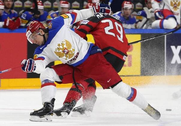 COLOGNE, GERMANY - MAY 20, 2017: Russia s Sergei Plotnikov (L), and Canada s Nate Mackinnon in their 2017 IIHF Ice hockey Eishockey World Championship WM Weltmeisterschaft semifinal match at Lanxess Arena; Canada won 4-2. Alexander Demianchuk TASS  TS04F6D5