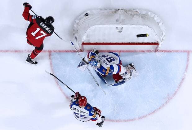 COLOGNE, GERMANY - MAY 20, 2017: Canada s Alex Killorn (top L), and Russia s goaltender Andrei Vasilevsky (top R) and Bogdan Kiselevich in their 2017 IIHF Ice hockey Eishockey World Championship WM Weltmeisterschaft semifinal match at Lanxess Arena; Canada won 4-2. Anton Novoderezhkin TASS  TS04F769