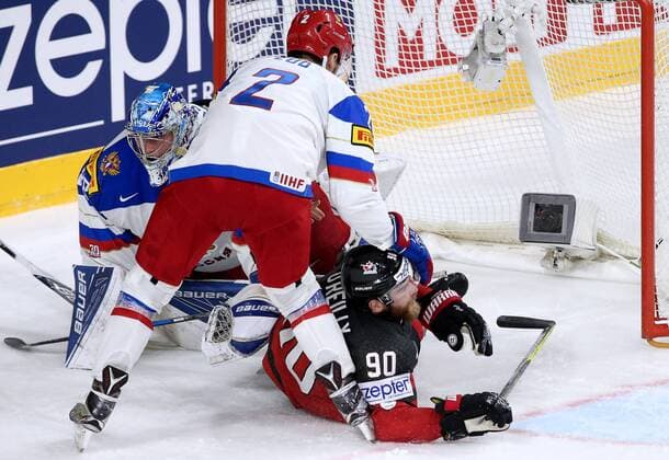 COLOGNE, GERMANY - MAY 20, 2017: Russia s Artyom Zub (front), goaltender Andrei Vasilevsky (L), and Canada s Ryan O Reilly in their 2017 IIHF Ice hockey Eishockey World Championship WM Weltmeisterschaft semifinal match at Lanxess Arena; Canada won 4-2. Anton Novoderezhkin TASS  TS04F716