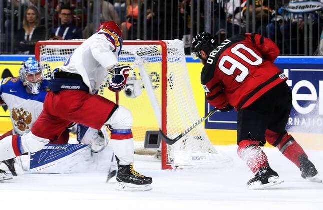COLOGNE, GERMANY - MAY 20, 2017: Canada s Ryan O Reilly (R) scores a goal past Russia s Andrei Vasilevsky (L), and an unidentified player in their 2017 IIHF Ice hockey Eishockey World Championship WM Weltmeisterschaft semifinal match at Lanxess Arena; Canada won 4-2. Alexander Demianchuk TASS  TS04F743
