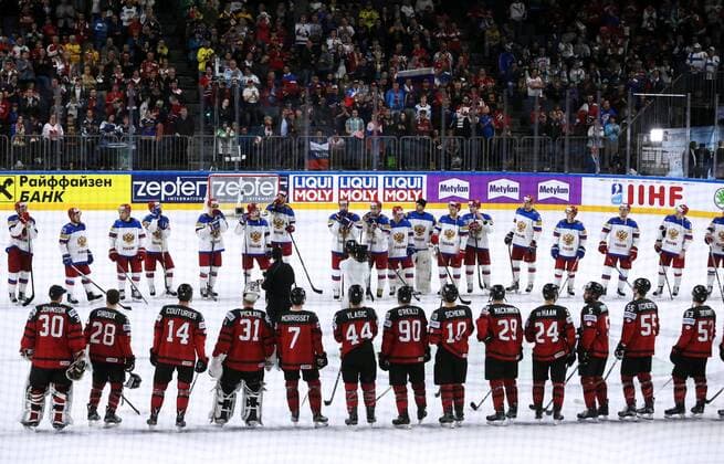 COLOGNE, GERMANY - MAY 20, 2017: Canadian (front) and Russian players after their 2017 IIHF Ice hockey Eishockey World Championship WM Weltmeisterschaft semifinal match at Lanxess Arena; Canada won 4-2. Alexander Demianchuk TASS  TS04F72B