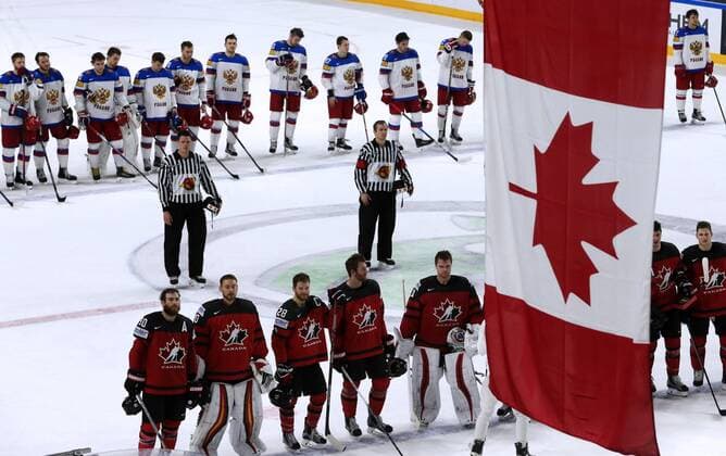 COLOGNE, GERMANY - MAY 20, 2017: Russian (back) and Canadian players after their 2017 IIHF Ice hockey Eishockey World Championship WM Weltmeisterschaft semifinal match at Lanxess Arena; Canada won 4-2. Alexander Demianchuk TASS  TS04F722