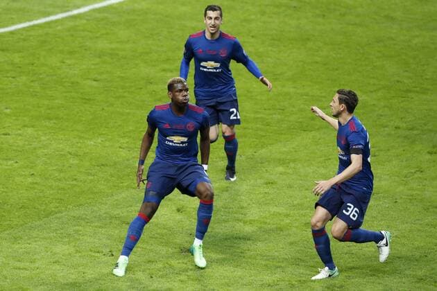 170524 Manchester Uniteds Paul Pogba med Henrikh Mkhitaryan och Matteo Darmian efter att han gjort 1-0-malet under finalen i Europa League mellan Ajax och Manchester United ManU den 24 maj 2017 i Stockholm.  Copyright: ANDREASxLxERIKSSON BB170524AE046