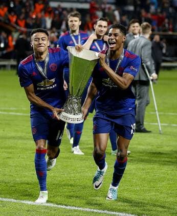 Jesse Lingard of Manchester United ManU and Marcus Rashford celebrate with the trophy after the UEFA Europa League Final match at the Friends Arena, Stockholm. Picture date: May 24th, 2017.Picture credit should read: Matt McNulty Sportimage EDITORIAL USE ONLY. No use with unauthorised audio, video, data, fixture lists, club league logos or live services. Online in-match use limited to 120 images, no video emulation. No use in betting, games or single club league player publications.
