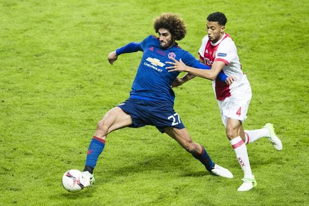 170524 Manchester Uniteds Marouane Fellaini och Ajax Jairo Riedewaldunder finalen i Europa League mellan Ajax och Manchester United ManU den 24 maj 2017 i Stockholm.  Copyright: ANDREASxLxERIKSSON BB170524AE100