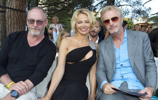 Monaco, Monte Carlo - May 26, 2017: Amber Lounge Fashion Show Monaco with F1 Pilot Eddie Irvine (r) and Actors Pamela Anderson and Liam Cunningham Amber Lounge Fashion Show Monaco 2017