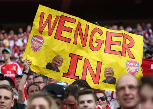 May 27th 2017, Wembley Stadium, London England; FA Cup Final, Arsenal versus Chelsea FC; Arsenal fan holds up giant banner dedicated to Arsenal Manager Manager Arsene Wenger saying WENGER IN during Arsenal s celebrations after defeating Chelsea by 2-1 xJohnxPatrickxFletcherx  ActionPlus11884426