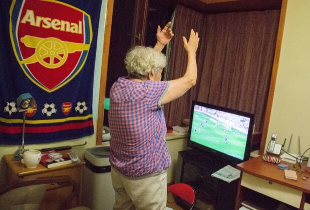 BEIJING, CHINA - MAY 28: 78-year-old gooner Liu Hongwen watches FA Cup Final between Arsenal and Chelsea at home on May 28, 2017 in Beijing, China. 78-year-old retired teacher Liu Hongwen became an Arsenal fan in 2002. On Liu s 75 birthday, her son registered a Sina Weibo account for her. She supports Arsenal on Weibo and becomes a web celebrity with a nickname Gooner Granny Liu .  Copyright: xVCGx CFP111103649924 
