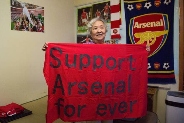 BEIJING, CHINA - MAY 27: 78-year-old gooner Liu Hongwen poses with the banner for Arsenal at home on May 27, 2017 in Beijing, China. 78-year-old retired teacher Liu Hongwen became an Arsenal fan in 2002. On Liu s 75 birthday, her son registered a Sina Weibo account for her. She supports Arsenal on Weibo and becomes a web celebrity with a nickname Gooner Granny Liu .  Copyright: xVCGx CFP111103649174 
