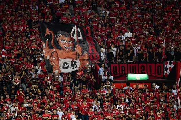 Football fans wave flags and shout slogans to show support for Japan s Urawa Red Diamonds in their second Round of 16 match against South Korea s Jeju United during the 2017 AFC Champions League in Urawa, Saitama, Japan, 31 May 2017. Urawa Red Diamonds defeated Jeju United 3-0 in their second Round of 16 match during the 2017 AFC Champions League in Saitama, Japan, 31 May 2017. Urawa Red Diamonds beats Jeju United in second Round of 16 match at AFC Champions League  20170531_61734