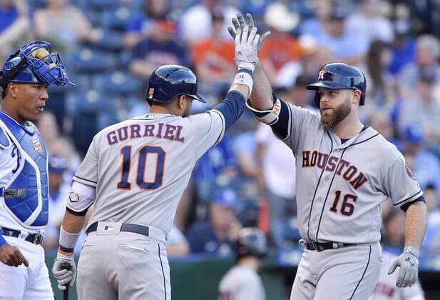 June 7, 2017 - Kansas City, MO, USA - The Houston Astros Brian McCann (16) is congratulated by Yuli Gurriel (10) in front of Kansas City Royals catcher Salvador Perez on a solo home run in the second inning at Kauffman Stadium in Kansas City, Mo., on Wednesday, June 7, 2017. Houston at Kansas City - ZUMAm67_ 20170607_zaf_m67_036 Copyright: xJohnxSleezerx