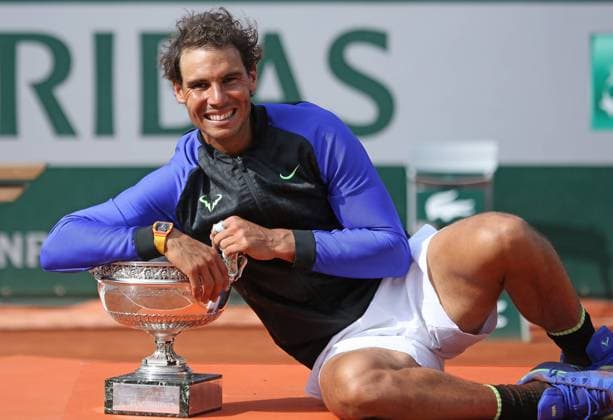 Rafael Nadal of Spain holds the championship trophy after winning his French Open men s final match against Stan Wawrinka of Switzerland at Roland Garros in Paris on June 11, 2017. Nadal defeated Wawrinka 6-2, 6-3, 6-1 to win his 10th French Open championship.  PAR20170611059 DAVIDxSILPA