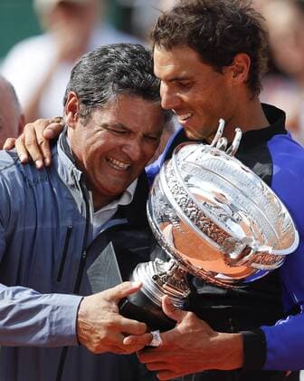(170612) -- PARIS, June 12, 2017 -- Rafael Nadal (R)of Spain and his uncle and coach Toni Nadal celebrate with the trophy after the men s singles final with Stan Wawrinka of Switzerland at French Open tennis tournament 2017 at Roland Garros, in Paris, France on June 11, 2017. Nadal won 3-0 to claim the title. ) HanxYan 