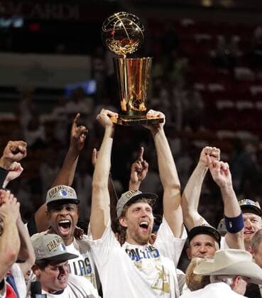 June 12, 2011 - Miami, FL, USA - Dirk Nowitzki of the Dallas Mavericks holds the championship trophy after defeating the Miami Heat during Game 6 of the NBA Basketball Herren USA Finals at the AmericanAirlines Arena in Miami on June 12, 2011. Mac Engel: Dirk did what LeBron cannot - ZUMAm67_ 20110612_zaf_m67_001 Copyright: xAlxDiazx