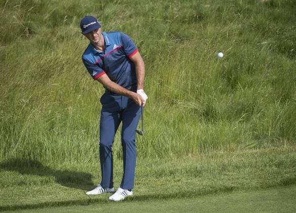 Dustin Johnson hits from the 12th fairway during round 1 of the 117th U.S. Open golf tournament at Erin Hill golf course in Erin, Wisconsin on June 15, 2017.  WIS20170615315 KEVINxDIETSCH