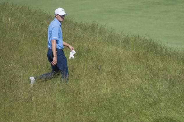 Jordan Spieth walks through fescue on the 12th fairway during round 1 of the 117th U.S. Open golf tournament at Erin Hill golf course in Erin, Wisconsin on June 15, 2017.  WIS20170615318 KEVINxDIETSCH