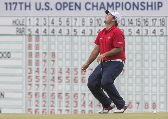Patrick Reed reacts to missing a putt on the 18th green during round 3 of the 117th U.S. Open golf tournament at Erin Hill golf course on June 17, 2017 in Erin, Wisconsin.  WIS20170617302 KEVINxDIETSCH