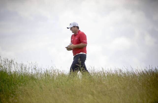 Patrick Reed walks on the 17th fairway during round 3 of the 117th U.S. Open golf tournament at Erin Hill golf course on June 17, 2017 in Erin, Wisconsin.  WIS20170617310 KEVINxDIETSCH