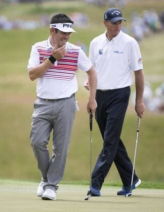 Louis Oosthuizen reacts to missing a putt not he 18th green alongside Jim Furyk during round 3 of the 117th U.S. Open golf tournament at Erin Hill golf course on June 17, 2017 in Erin, Wisconsin.  WIS20170617311 KEVINxDIETSCH