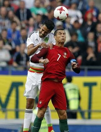 Portugal vs. Mexico KAZAN, RT - 18.06.2017: PORTUGAL VS. MEXICO - CRISTIANO RONALDO of Portugal contests ball with REYES Diego de México during a match between Portugal and Mexico valid for the first round of the Confederations Cup 2017 on Sunday (18) held at the Kazan Arena in Kazan, Russia. (Photo: Rodolfo Buhrer La Imagem Fotoarena) x1339231x  RodolfoxBuhrer