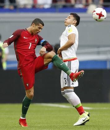 Portugal vs. Mexico KAZAN, RT - 18.06.2017: PORTUGAL VS. MEXICO - CRISTIANO RONALDO of Portugal contests ball with SALCEDO Carlos of Mexico during a match between Portugal and Mexico valid for the first round of the Confederations Cup 2017, this Sunday (18), held at the Kazan Arena in Kazan, Russia. (Photo: Rodolfo Buhrer La Imagem Fotoarena) x1339232x  RodolfoxBuhrer