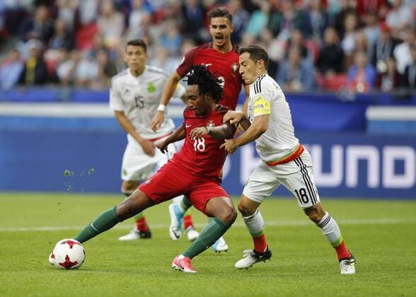 Portugal vs. Mexico KAZAN, RT - 18.06.2017: PORTUGAL VS. MEXICO - GUARDADO Andres de México plays the ball with GELSON MARTINS of Portugal during a match between Portugal and Mexico valid for the first round of the Confederations Cup 2017 on Sunday (18) held at the Kazan Arena in Kazan, Russia. (Photo: Rodolfo Buhrer La Imagem Fotoarena) x1339422x  RodolfoxBuhrer