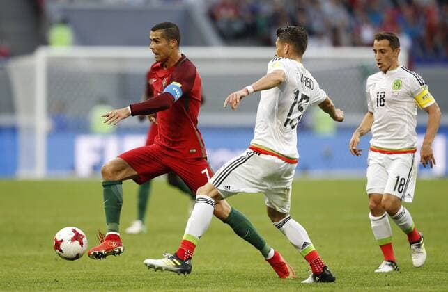Portugal vs. Mexico KAZAN, RT - 18.06.2017: PORTUGAL VS. MEXICO - CRISTIANO RONALDO of Portugal contests bid with MORENO Hector of Mexico during a match between Portugal and Mexico valid for the first round of the Confederations Cup 2017, this Sunday (18), held at the Kazan Arena in Kazan, Russia. (Photo: Rodolfo Buhrer La Imagem Fotoarena) x1339425x  RodolfoxBuhrer